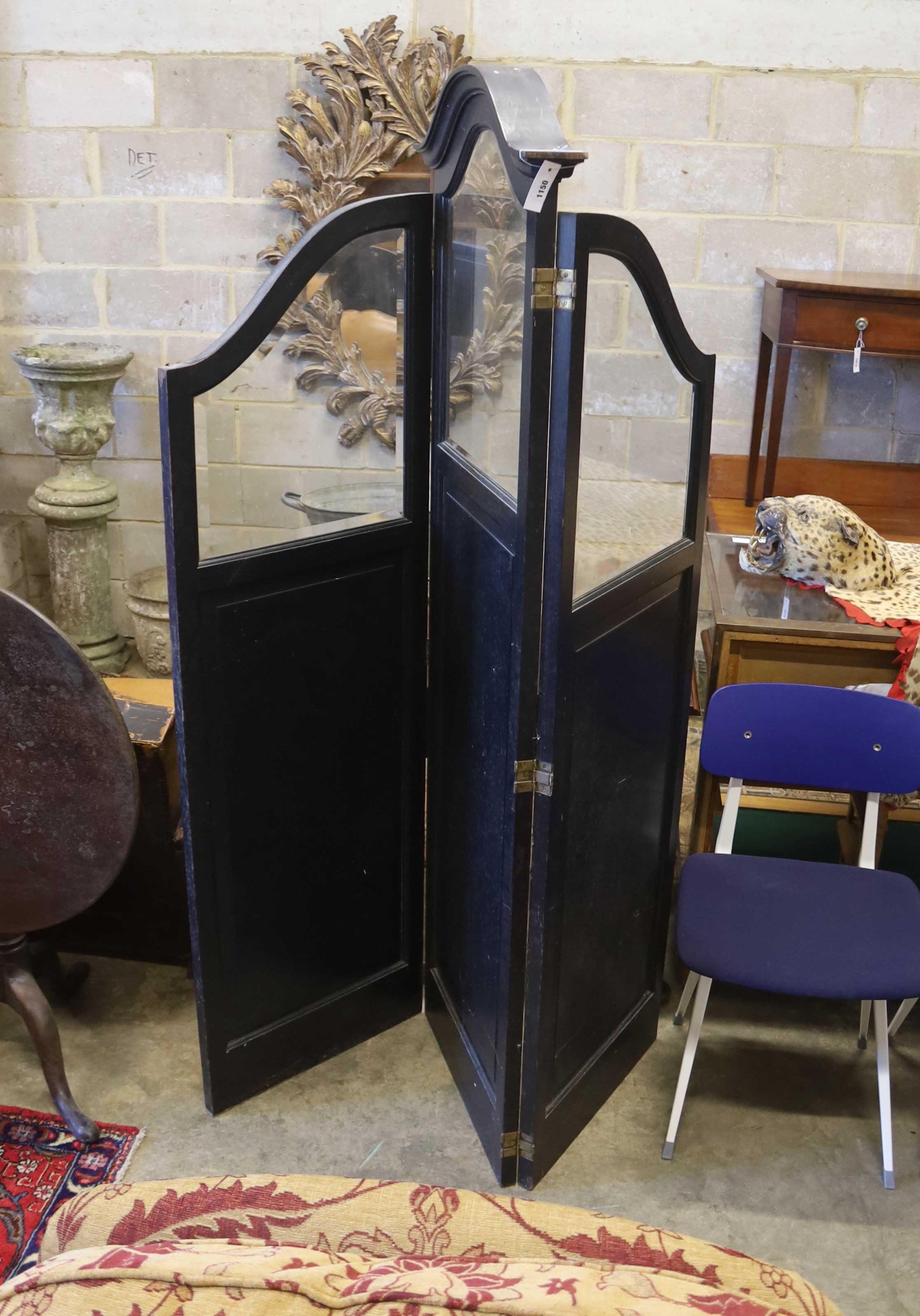 An early 20th century glazed and ebonised oak three fold dressing screen, height 192cm